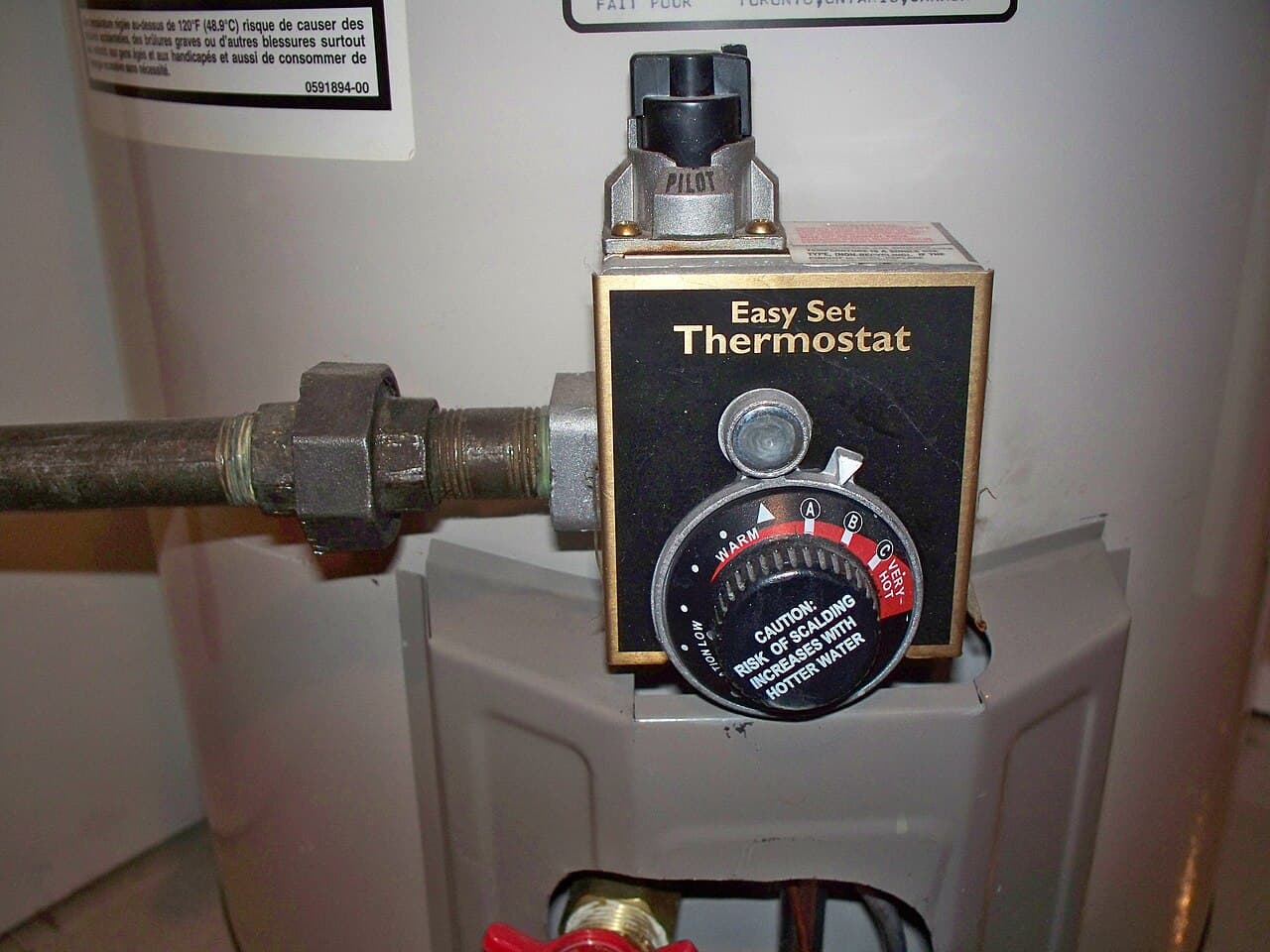 The temperature dial on a gas water heater's control valve